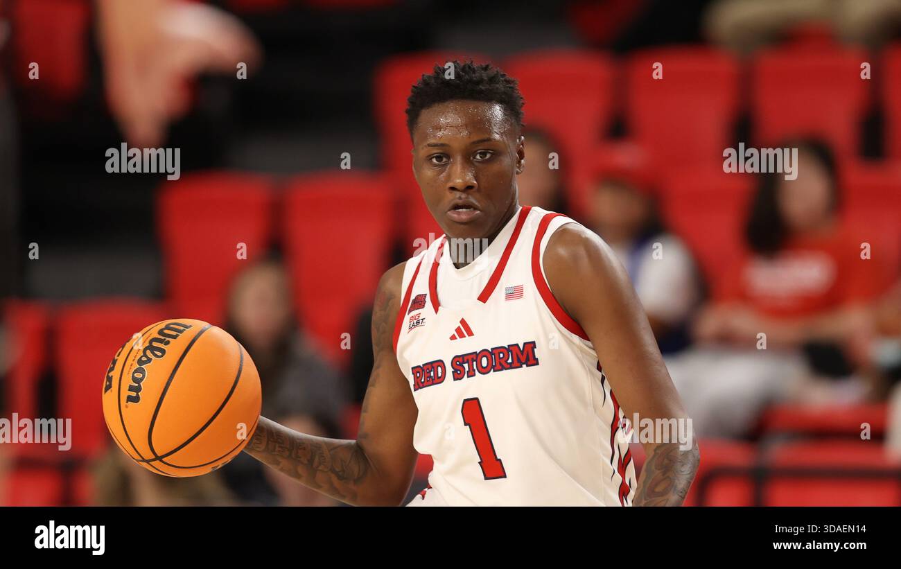 St. John's guard Beautiful Waheed (1) dribbles the ball during an NCAA ...