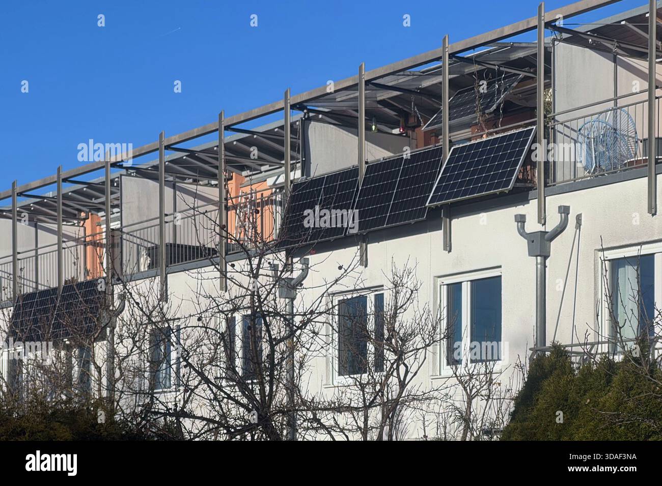 Balcony power plant on the railing of a balcony at an apartment.  Photovoltaic system. Solar cells, solar modules, residential building,  Solar power, solar energy Stock Photo - Alamy