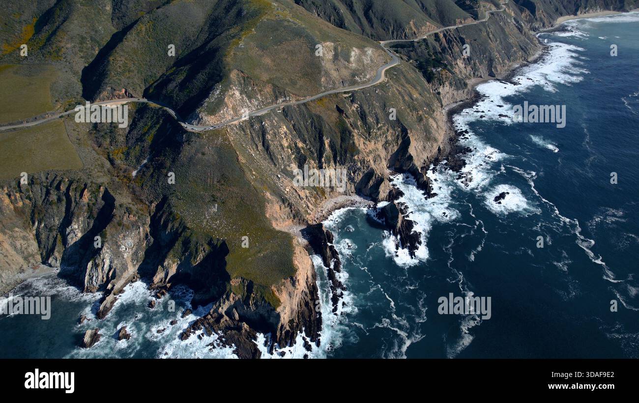 Aerial view of the winding Highway 1 snaking along the rugged Big Sur ...