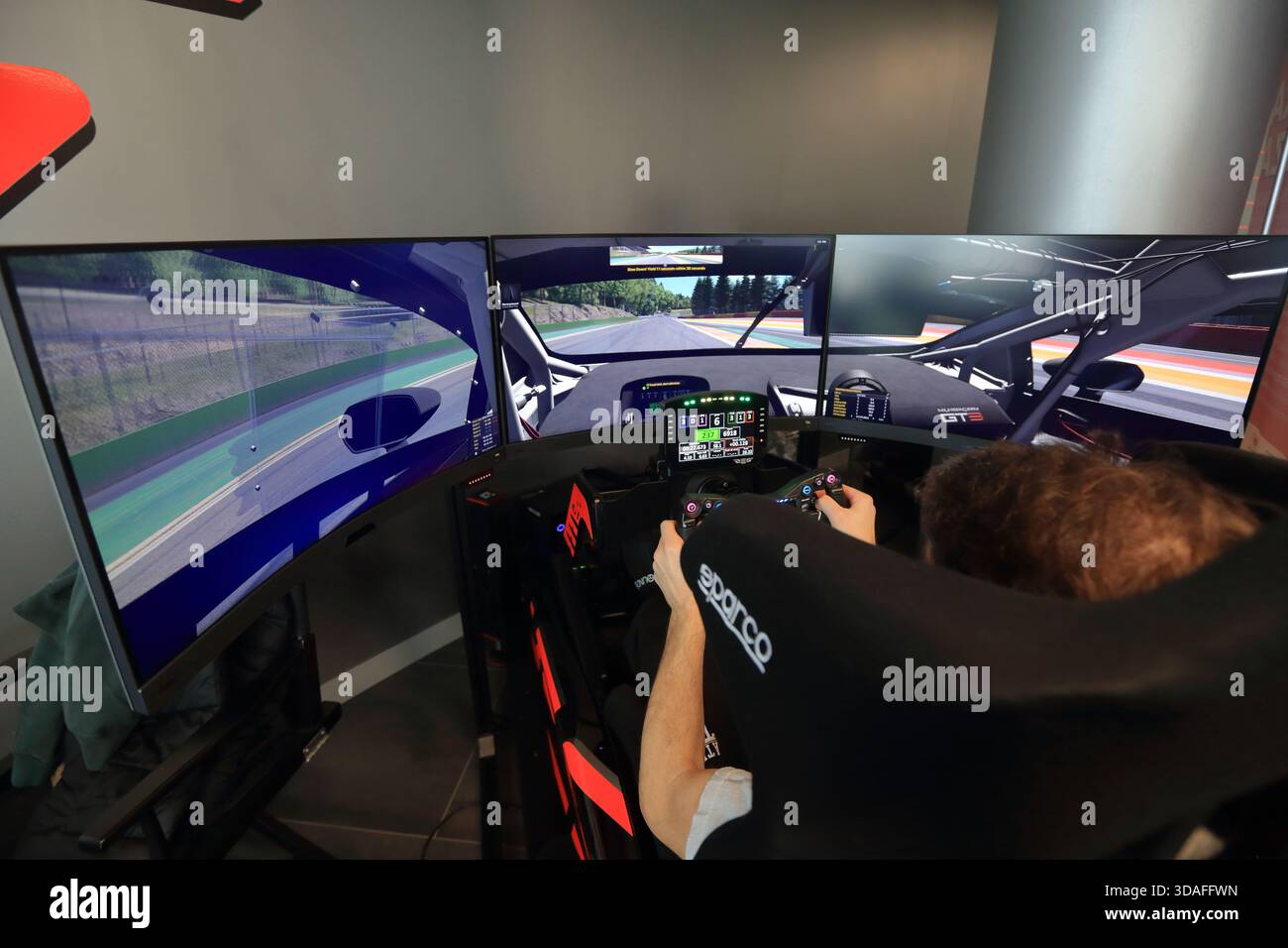 Players participate in a race in the racing car driving simulator at the Misano World Circuit Marco Simoncelli - Stock Image