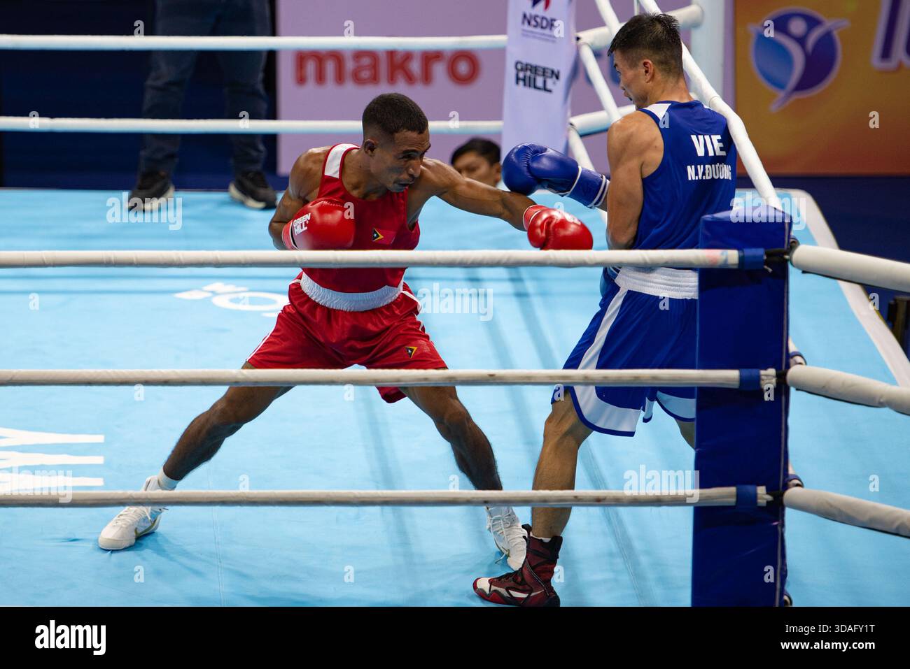DE JESUS GRIGORIO (RED) of Timor-Leste in action against NGUYEN VAN ...
