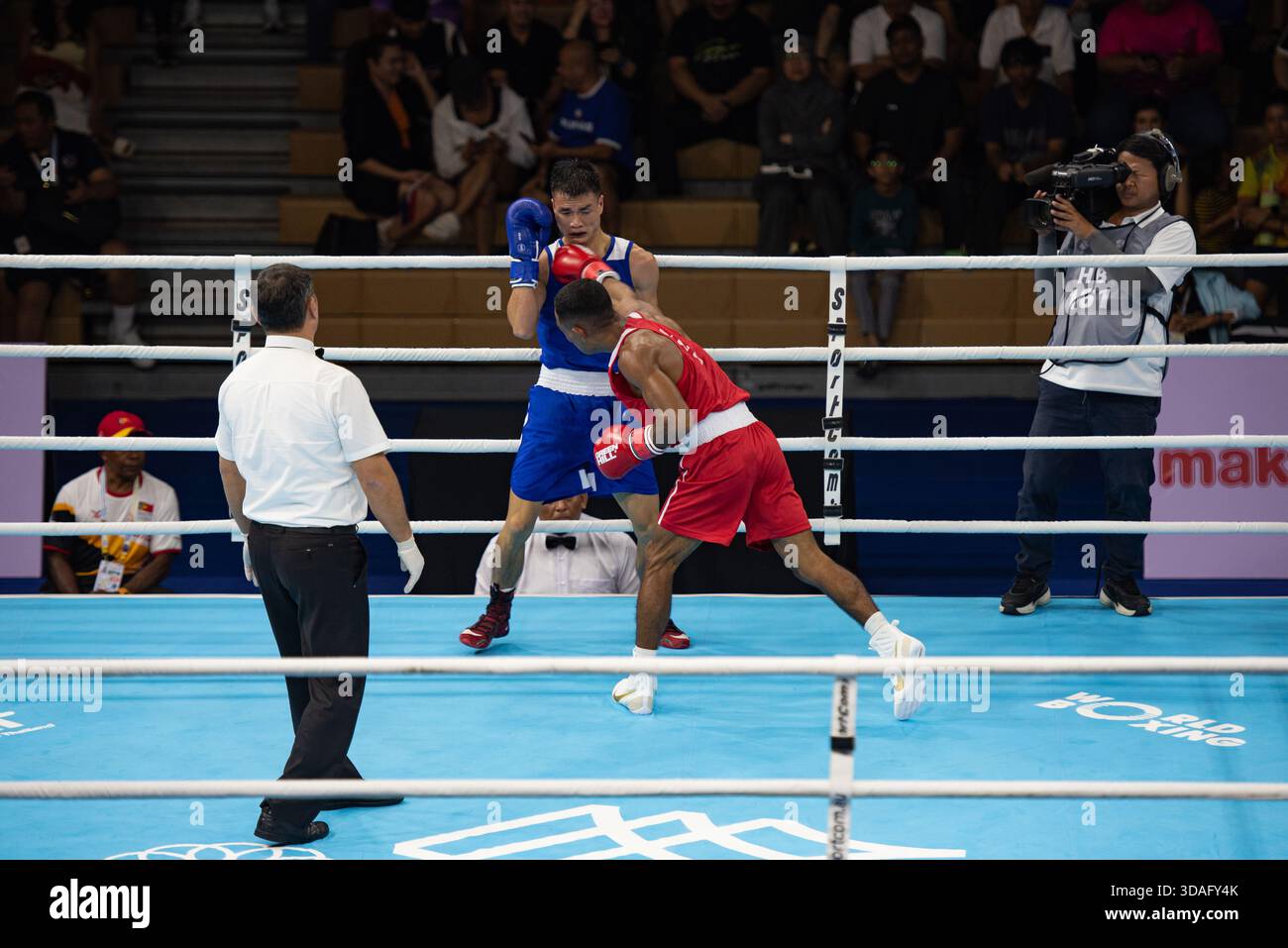 DE JESUS GRIGORIO (RED) of Timor-Leste in action against NGUYEN VAN ...