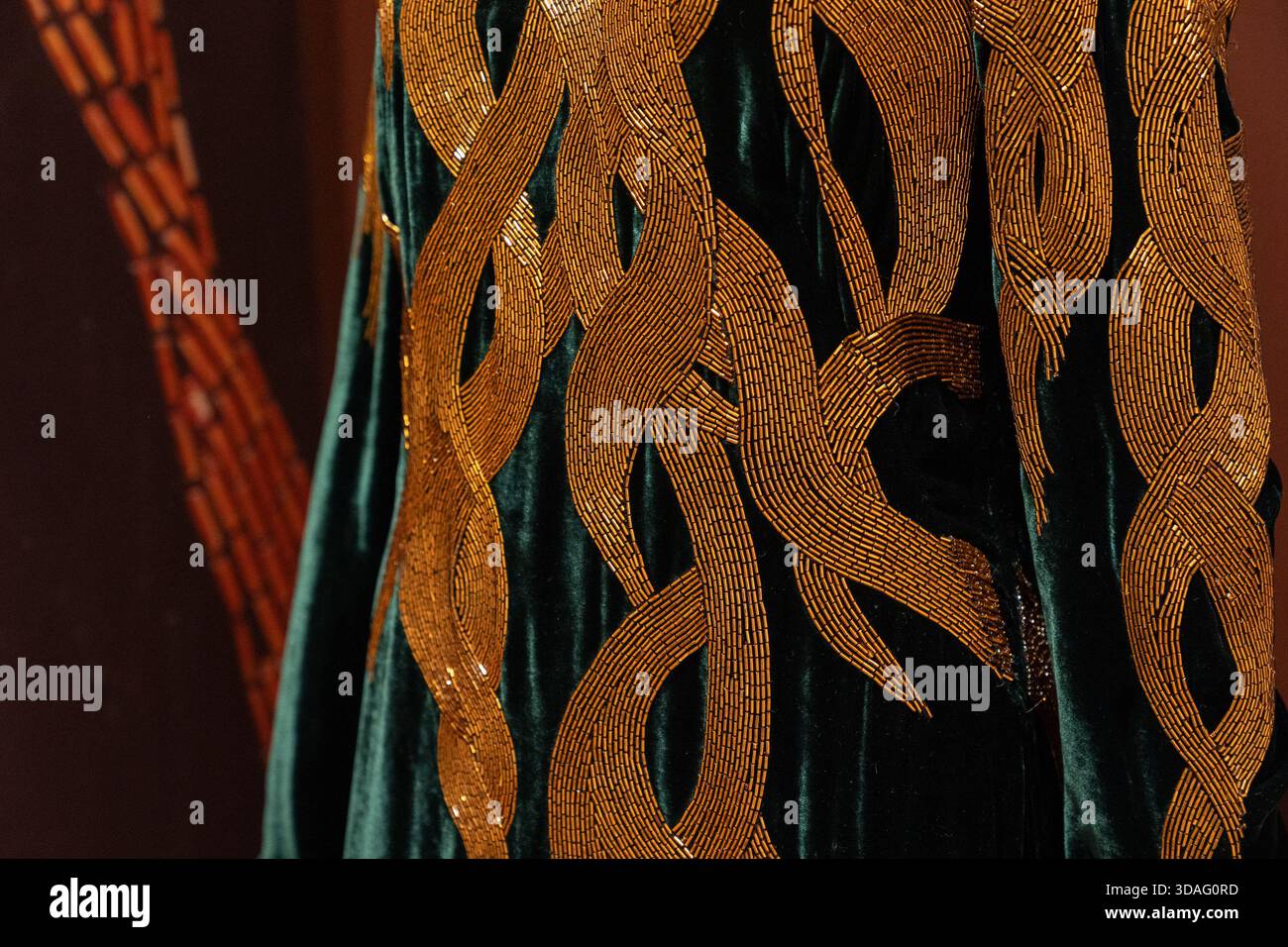 Green Velvet and Bugle Beaded Evening Gown, 'In Memory of Elizabeth Howe,  Salem 1692' by Alexander McQueen on display at Sotheby's in New York, NY on  December 8, 2025 Stock Photo - Alamy