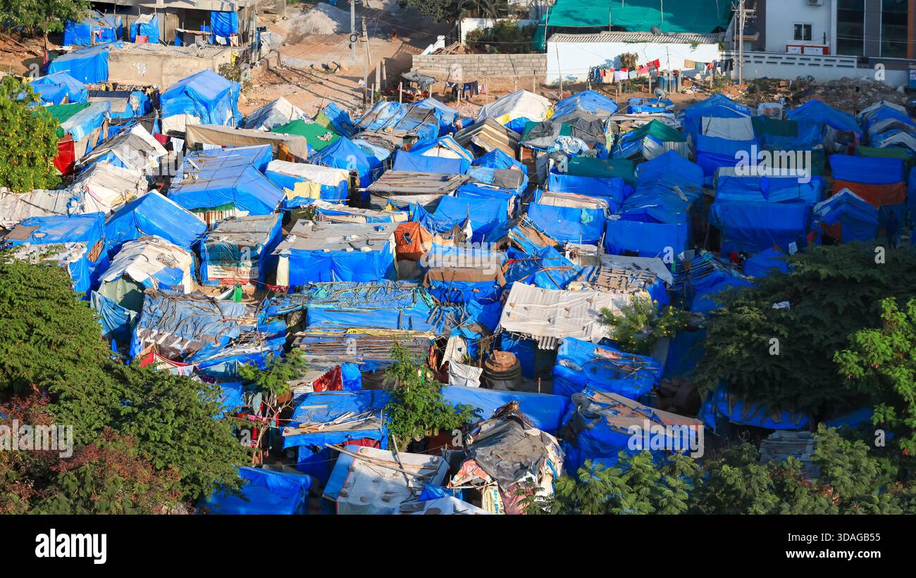 Blue color plastic handmade temporary housing and shelters in a slum ...