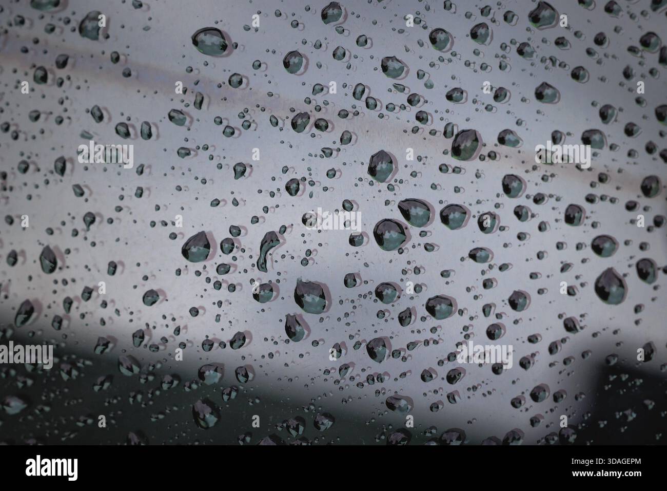 Close up on a raindrops on a window surface Stock Photo