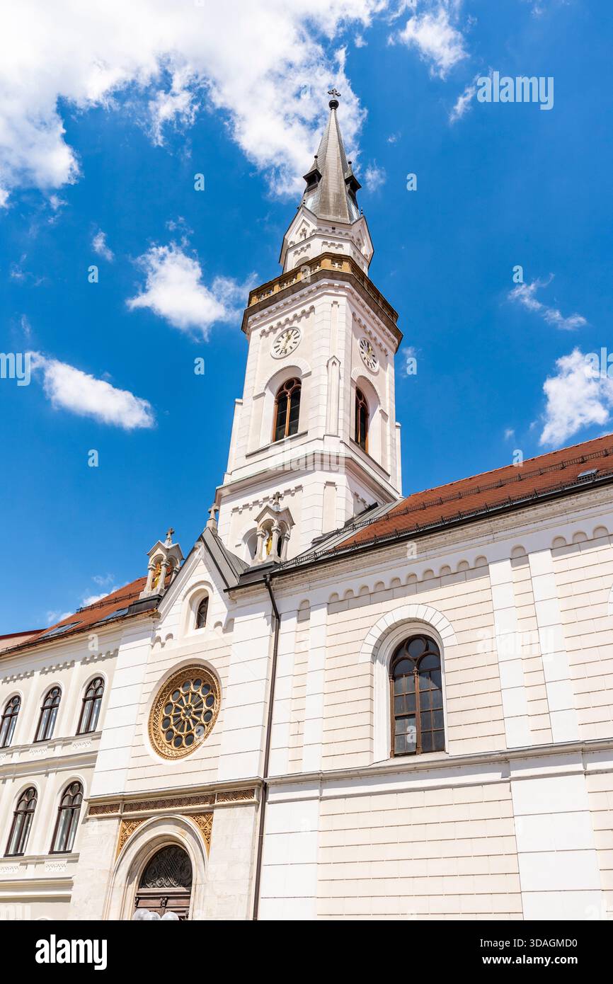 Church of the Assumption of Mary (cerkev Marijinega vnebovzetja) in Presernova ulica with Neo-Romanesque bell tower, Celje city center, Slovenia Stock Photo