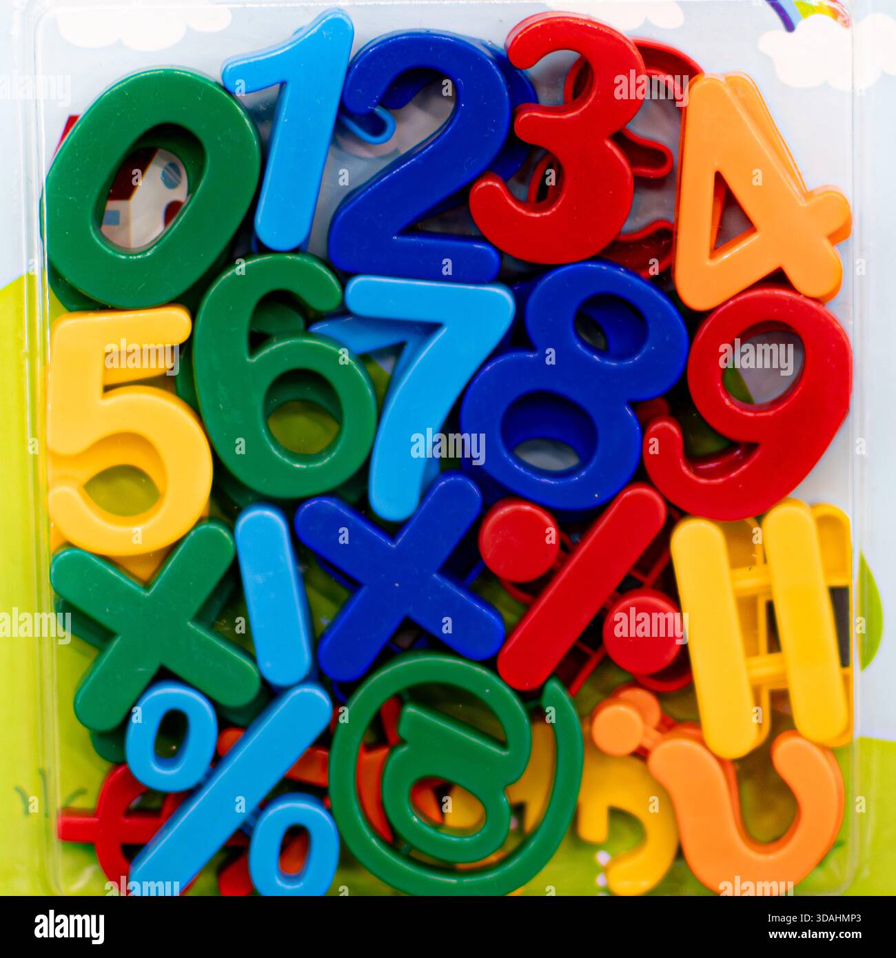 Bright and colorful plastic numbers and alphabet letters designed for kids, arranged playfully to encourage early learning and creativity. The smooth Stock Photo