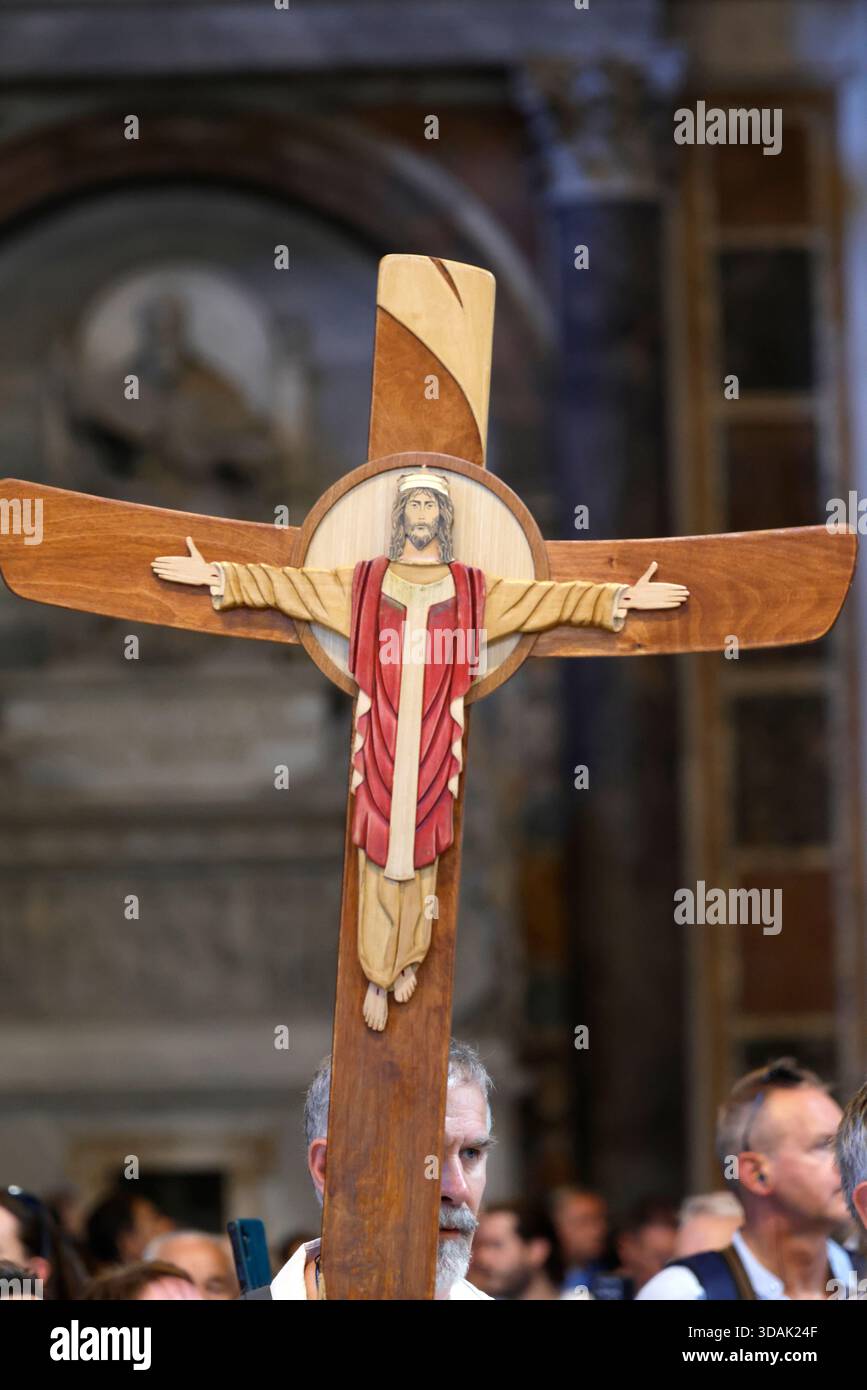 St. Peter’s Basilica.Wooden processional cross with welcoming Christ ...