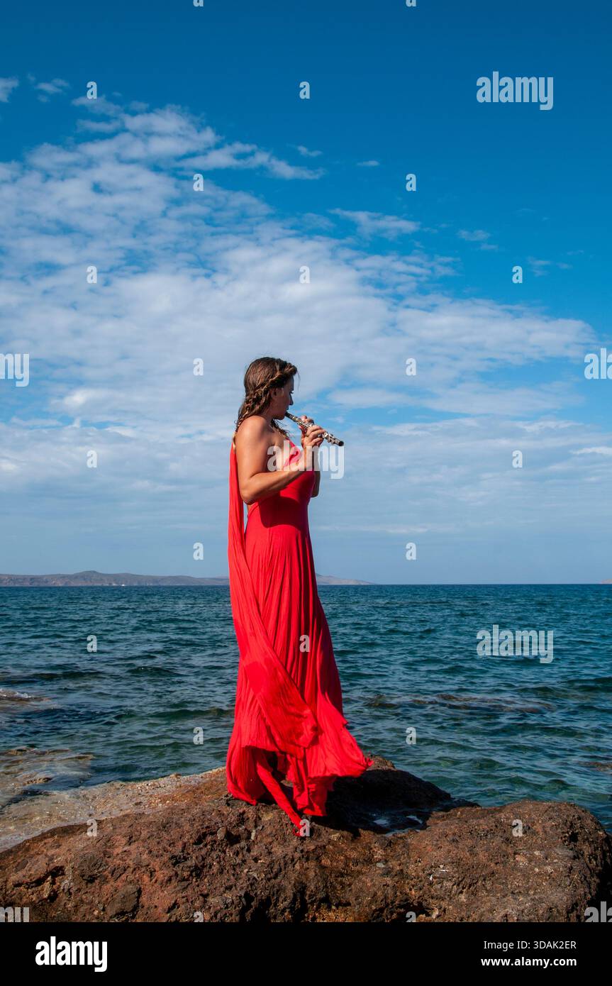 Red flowing dress hi-res stock photography and images - Alamy