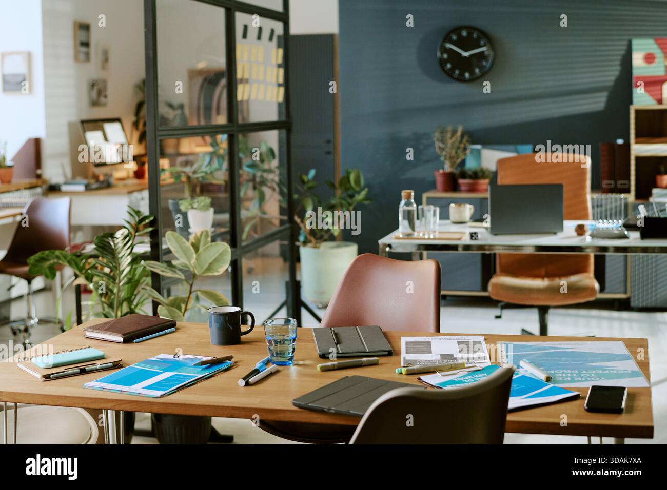 Modern Office Workspace Featuring Documents and Digital Devices on Table Stock Photo