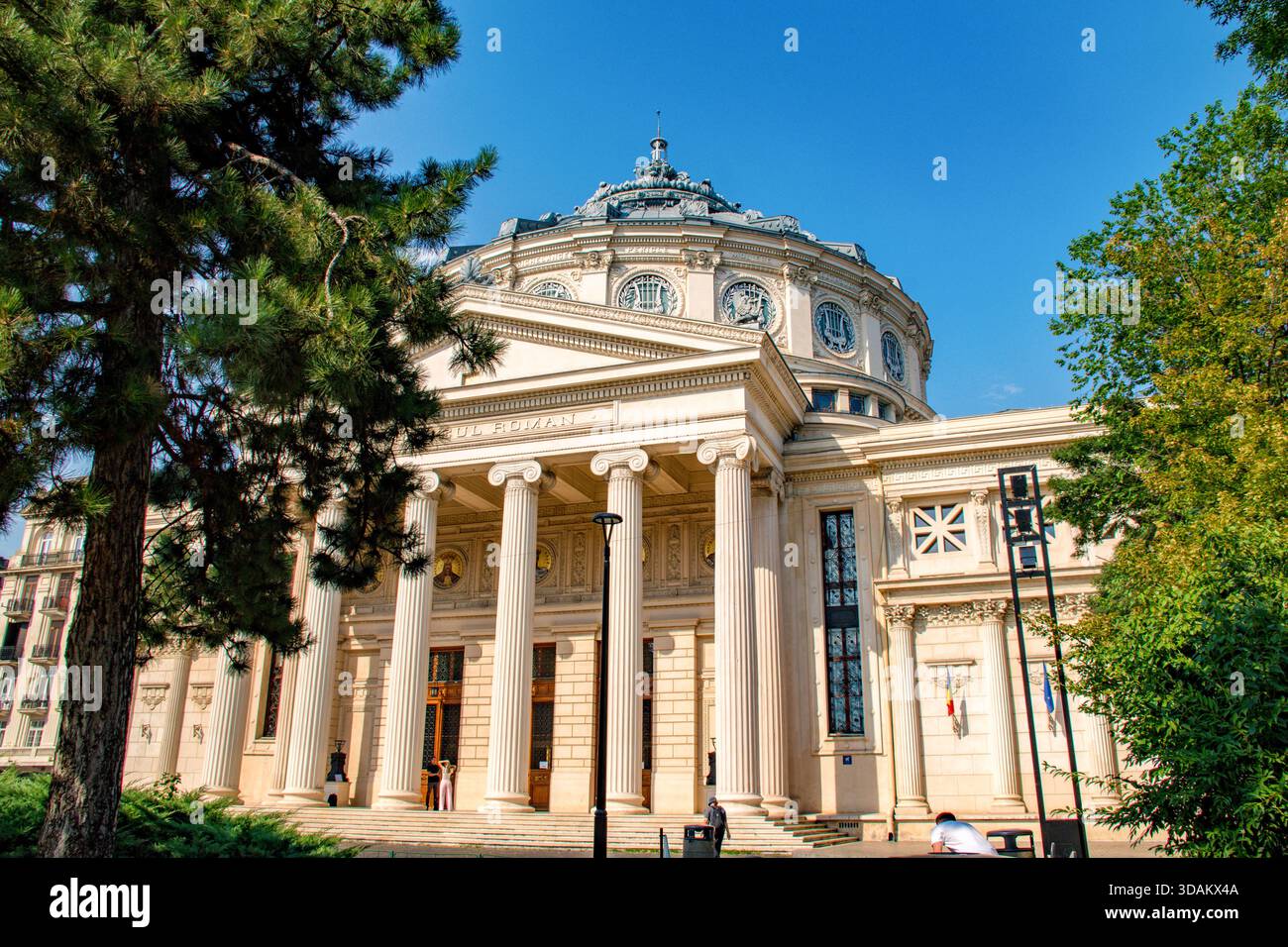 The Romanian Atheneum located in the centre of Bucharest, a landmark of the romanian capital city,opened in 1888,Mihai Eminescu statue in front of Rom Stock Photo