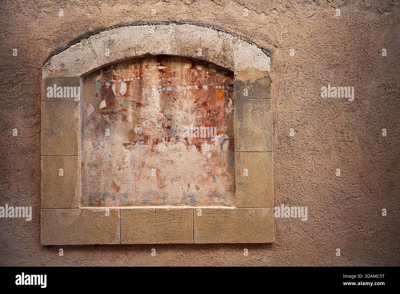 Boarded-up window in a plastered wall Stock Photo