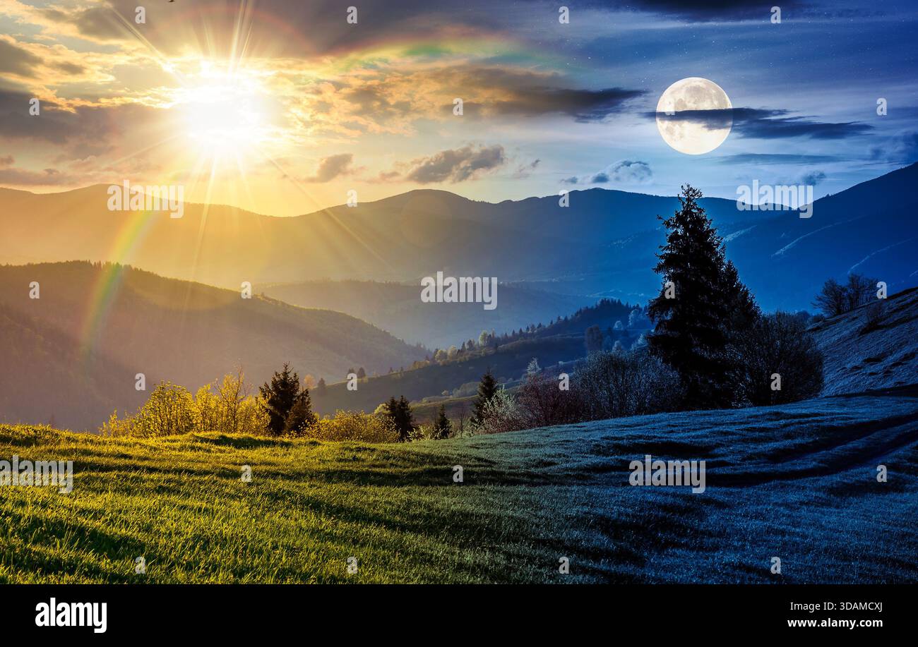 beautiful countryside landscape on spring equinox. day and night time change concept. green grassy slopes of mountainous rural area with sun and moon Stock Photo