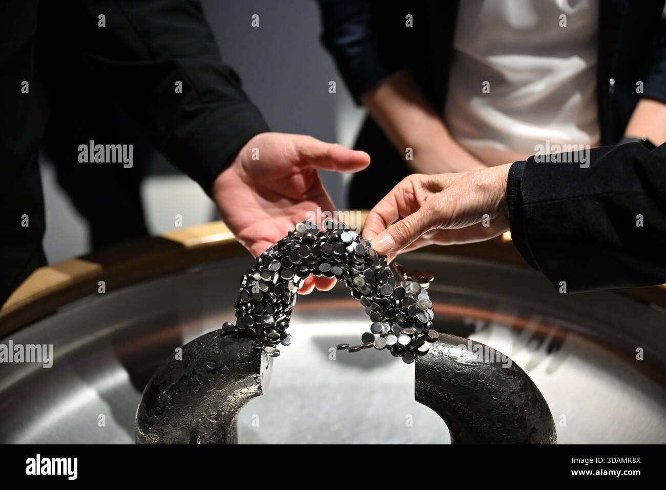 Wolfsburg, Germany. 11th Dec, 2025. View of an interactive magnet station at the phaeno exhibition. Following the refurbishment, the science museum is showing around 200 revised exhibits, 50 new exhibits and a completely redesigned exhibition landscape. Credit: Shireen Broszies/dpa/Alamy Live News Stock Photo