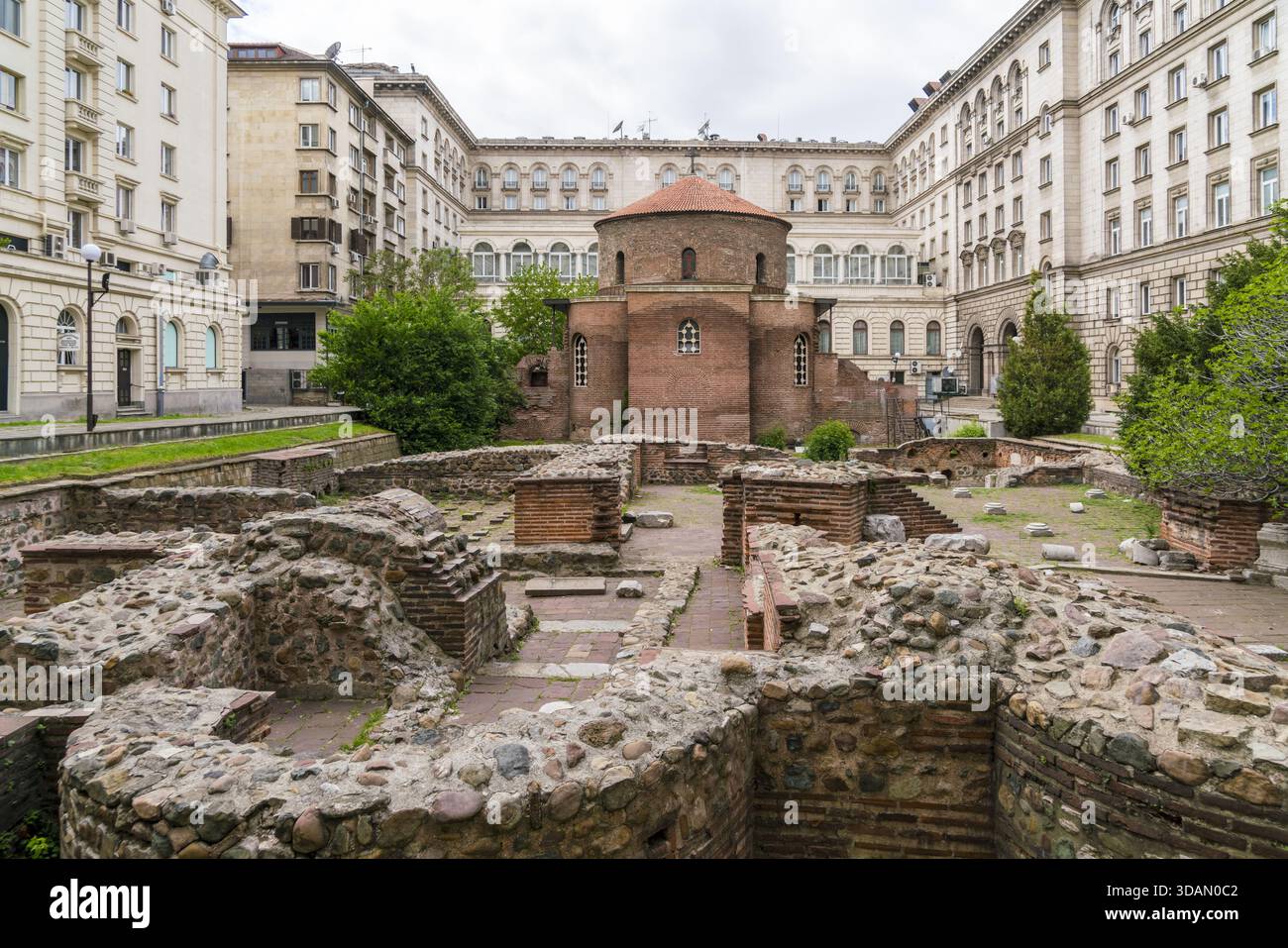 View of ancient ruins contrasting with modern architecture under a ...