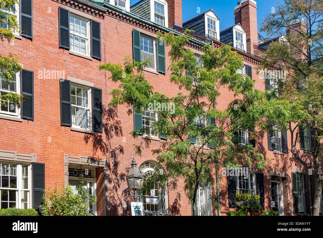 The iconic red brick facades and black shutters of the historic ...