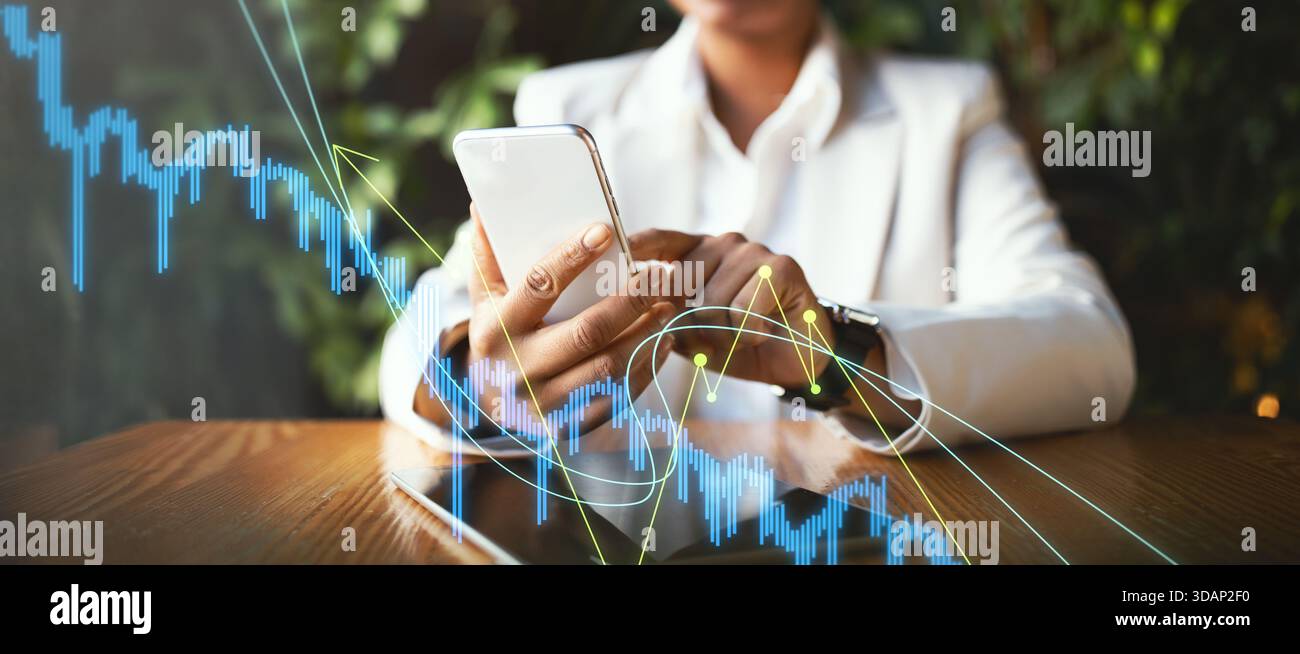 Business Professional Analyses Market Trends Using Mobile Device in Modern Workspace Stock Photo