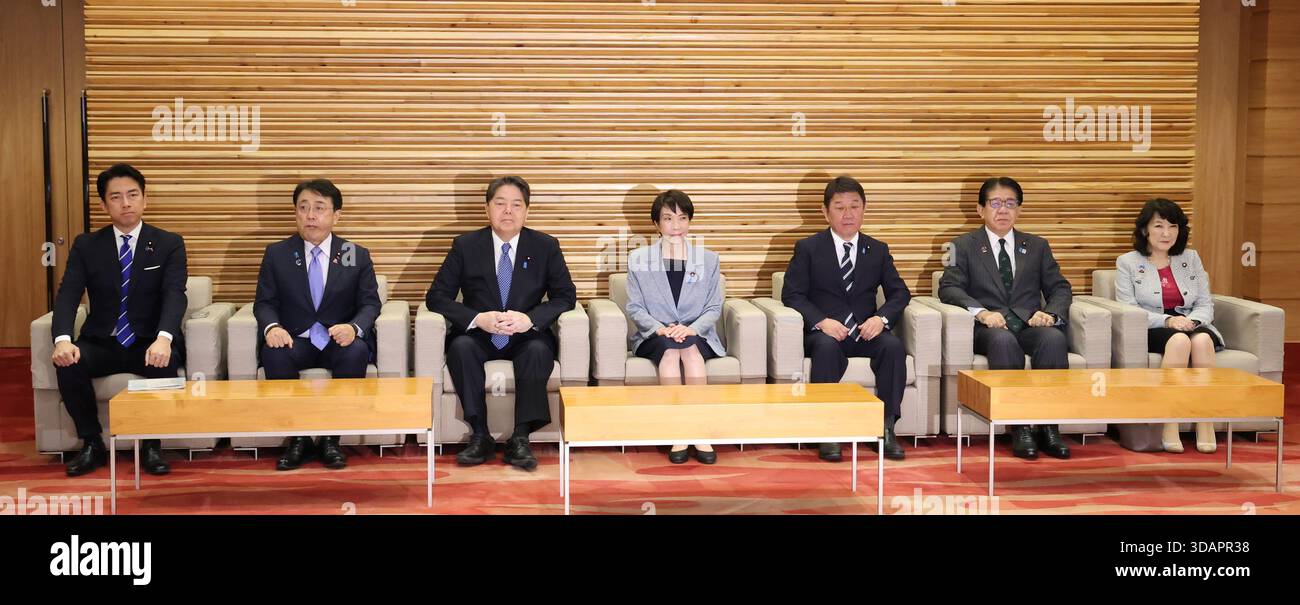 Japanese Prime Minister Sanae Takaichi (C) attends a cabinet meeting at ...