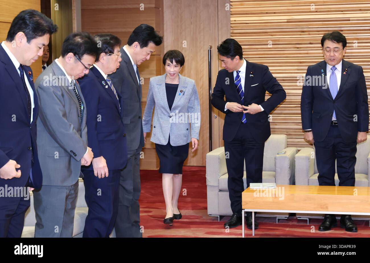 Japanese Prime Minister Sanae Takaichi (C) attends a cabinet meeting at ...