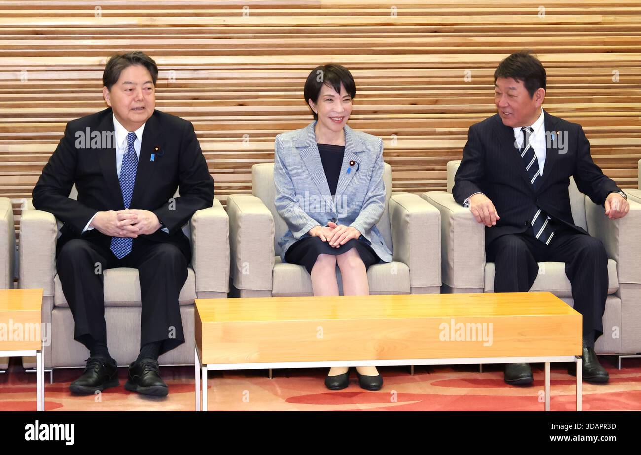 Japanese Prime Minister Sanae Takaichi (C) attends a cabinet meeting at ...