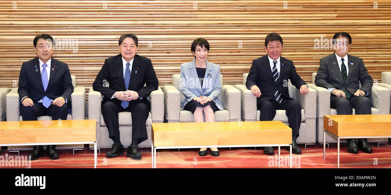 Japanese Prime Minister Sanae Takaichi (C) attends a cabinet meeting at ...