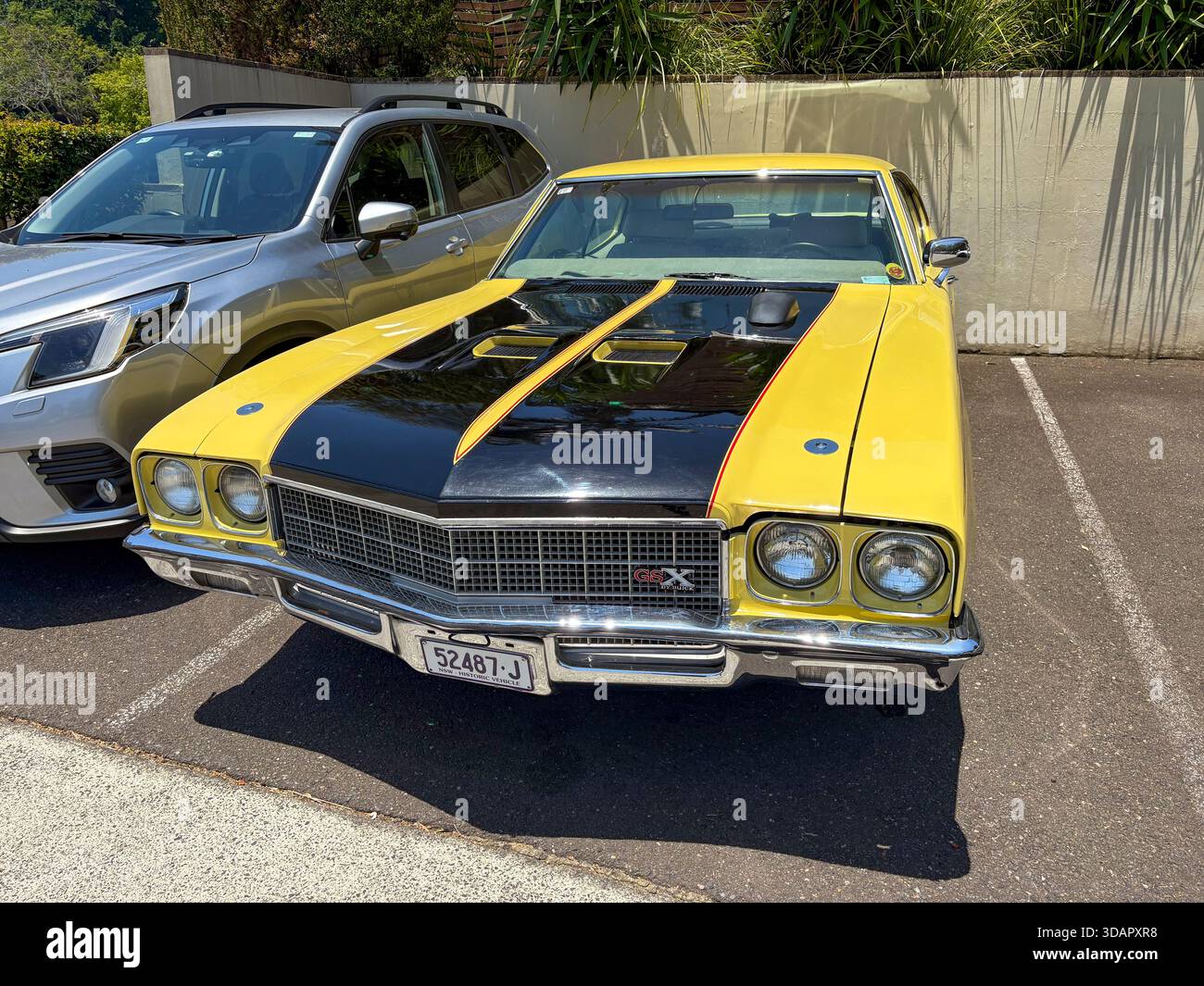 1972 Buick Skylark Coupe GSX model in yellow and black parked outside in Sydney,NSW,Australia - Smartphone Captured Stock Image