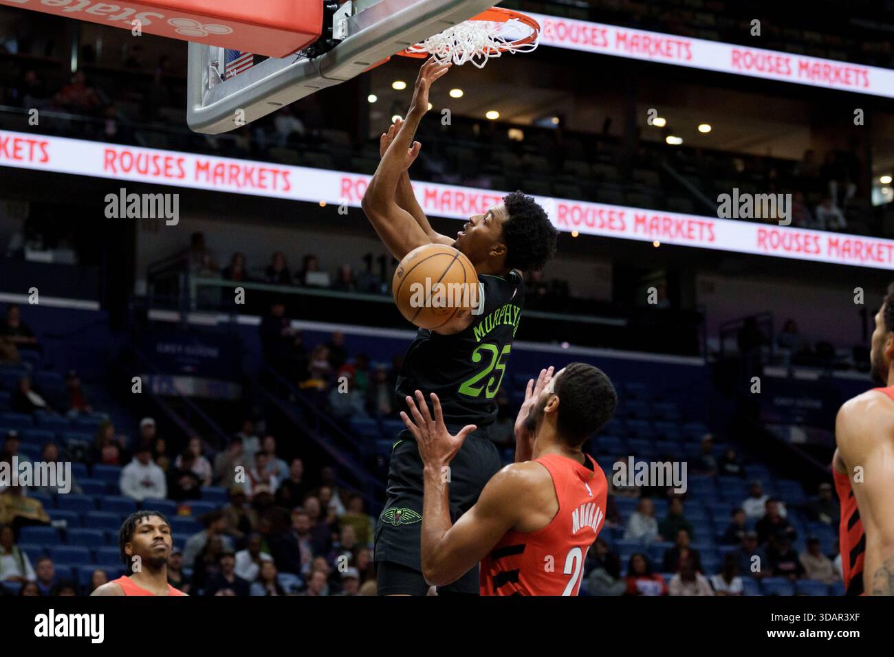 New Orleans Pelicans forward Trey Murphy III (25) reverse dunks against ...