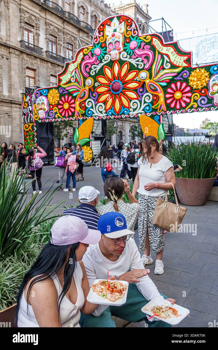 Mexico City Mexico, Centro Historico historic center, Zocalo Day of the Dead Dia de Muertos, colorful arch with skull art floral designs festival deco Stock Photo