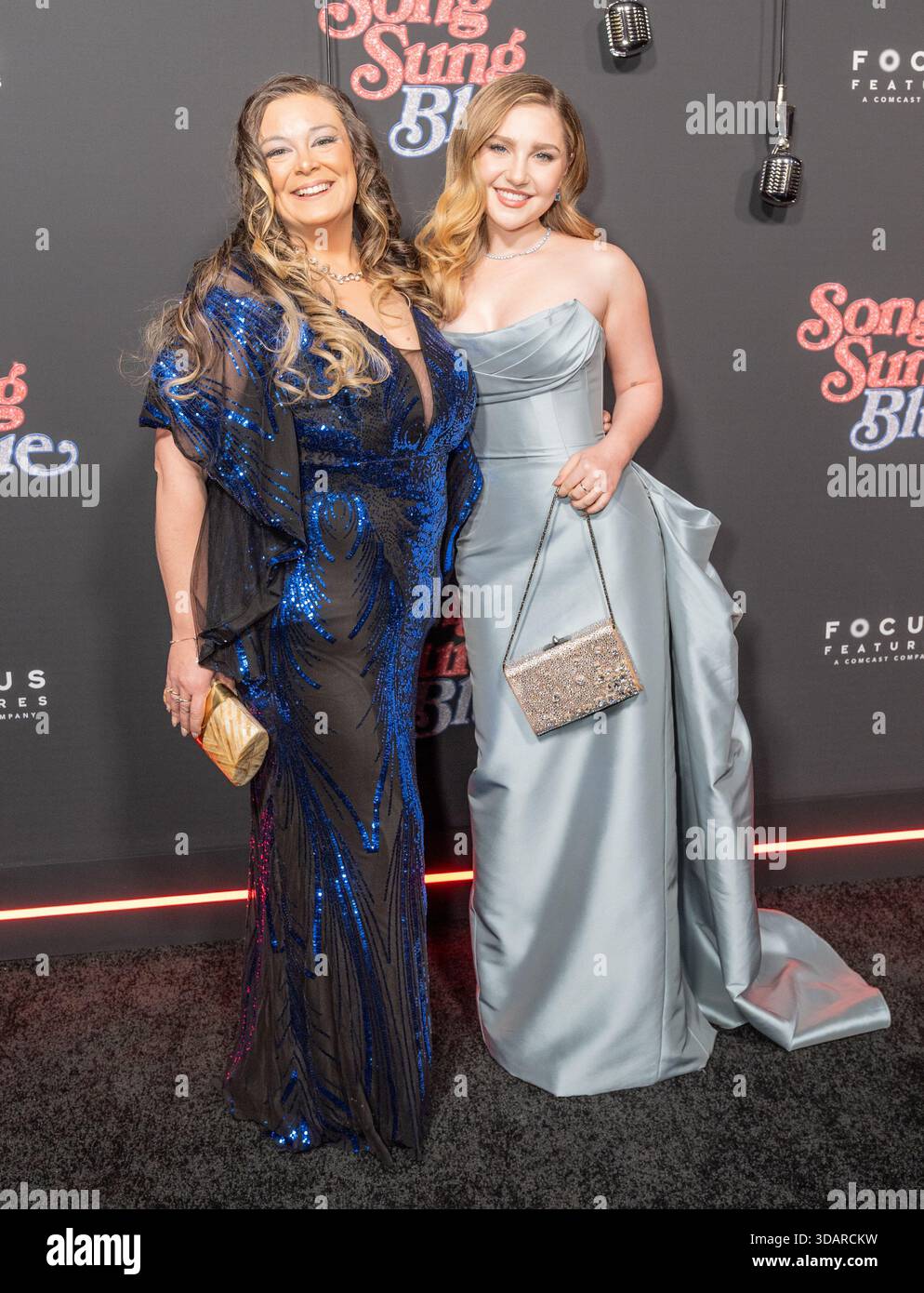 New York, United States. 11th Dec, 2025. Rachel Cartwright and Ella  Anderson wearing dress by Anne Barge attend premiere of Song Sung Blue by  FocusFeatures at AMC Lincoln Square in New York,