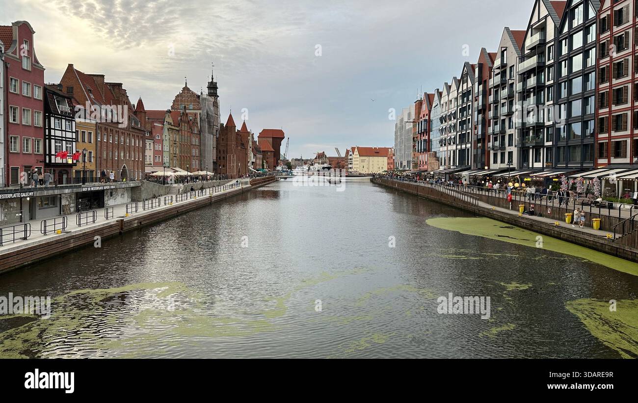 The Motława River in Gdańsk, Poland, featuring historic Hanseatic buildings and modern architecture. - Stock Image