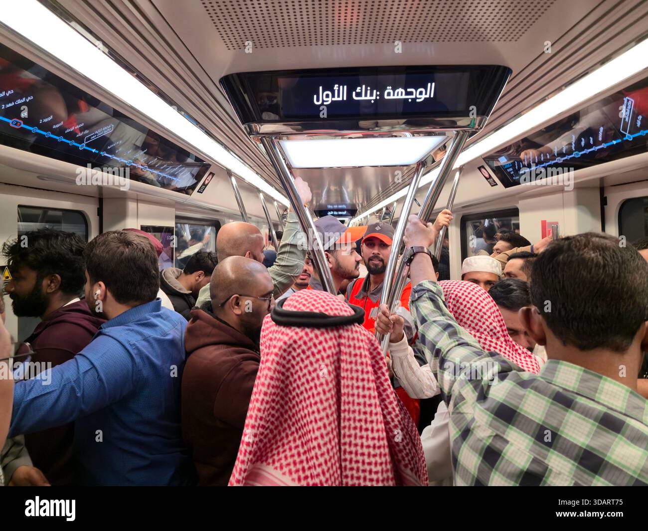 Passengers on the modern metro train in Riyad, Saudi Arabia. - Smartphone Captured Stock Image