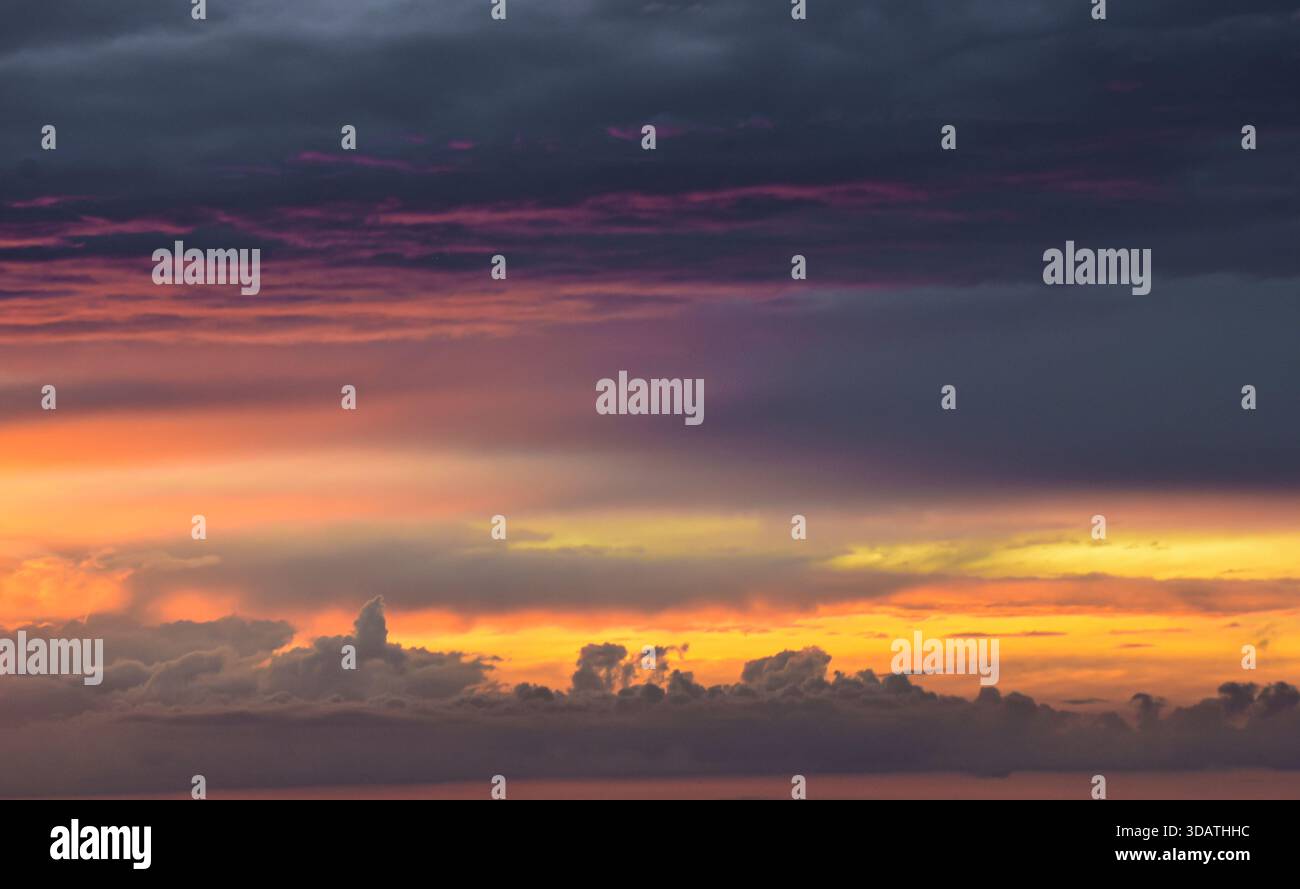Nature’s abstract masterpiece: vivid colors and soft light creating a unique, inspiring, and mesmerizing texture across the vast heaven canvas. Stock Photo