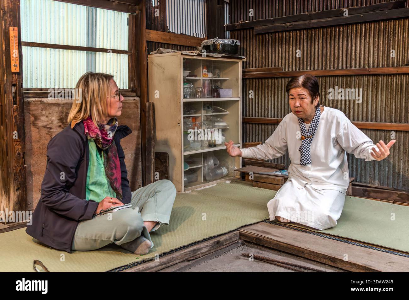 Travel journalist Angela Berg in conversation with ama diver Kimiyo ...