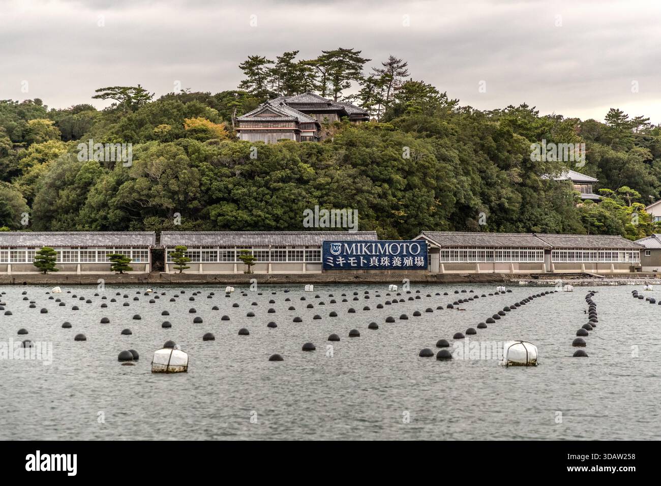 From the waters of Ago Bay, you can see the sprawling facilities of the Mikimoto pearl farm and the offshore oyster beds. Shima, Mie, Japan Stock Photo