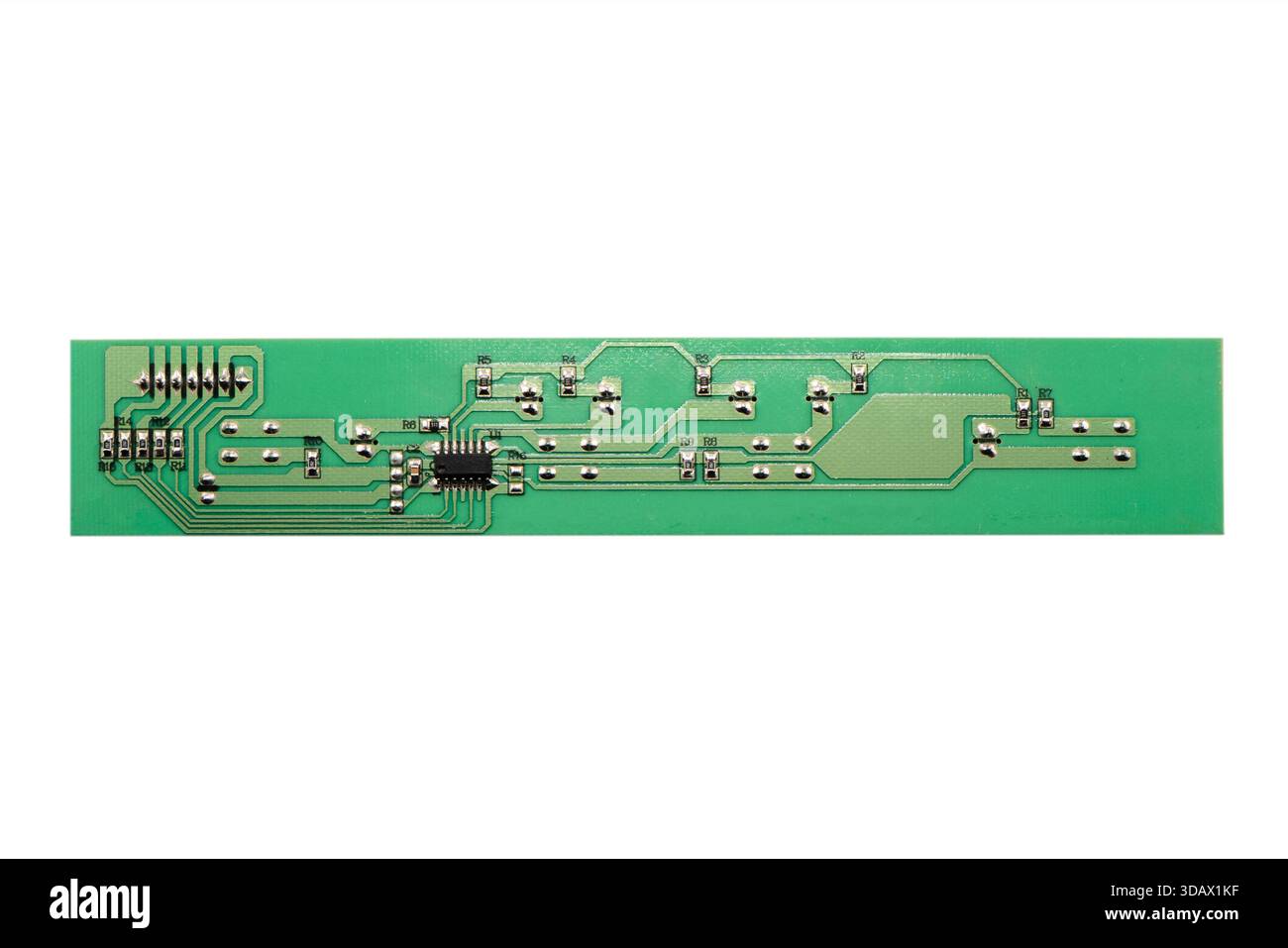 Circuit board with resistors microchips and electronic components isolated on white  background. Computer hardware technology. Stock Photo