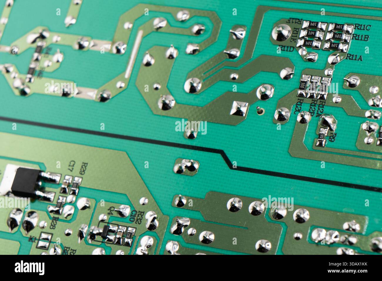 Circuit board with resistors microchips and electronic components background. Computer hardware technology. Stock Photo