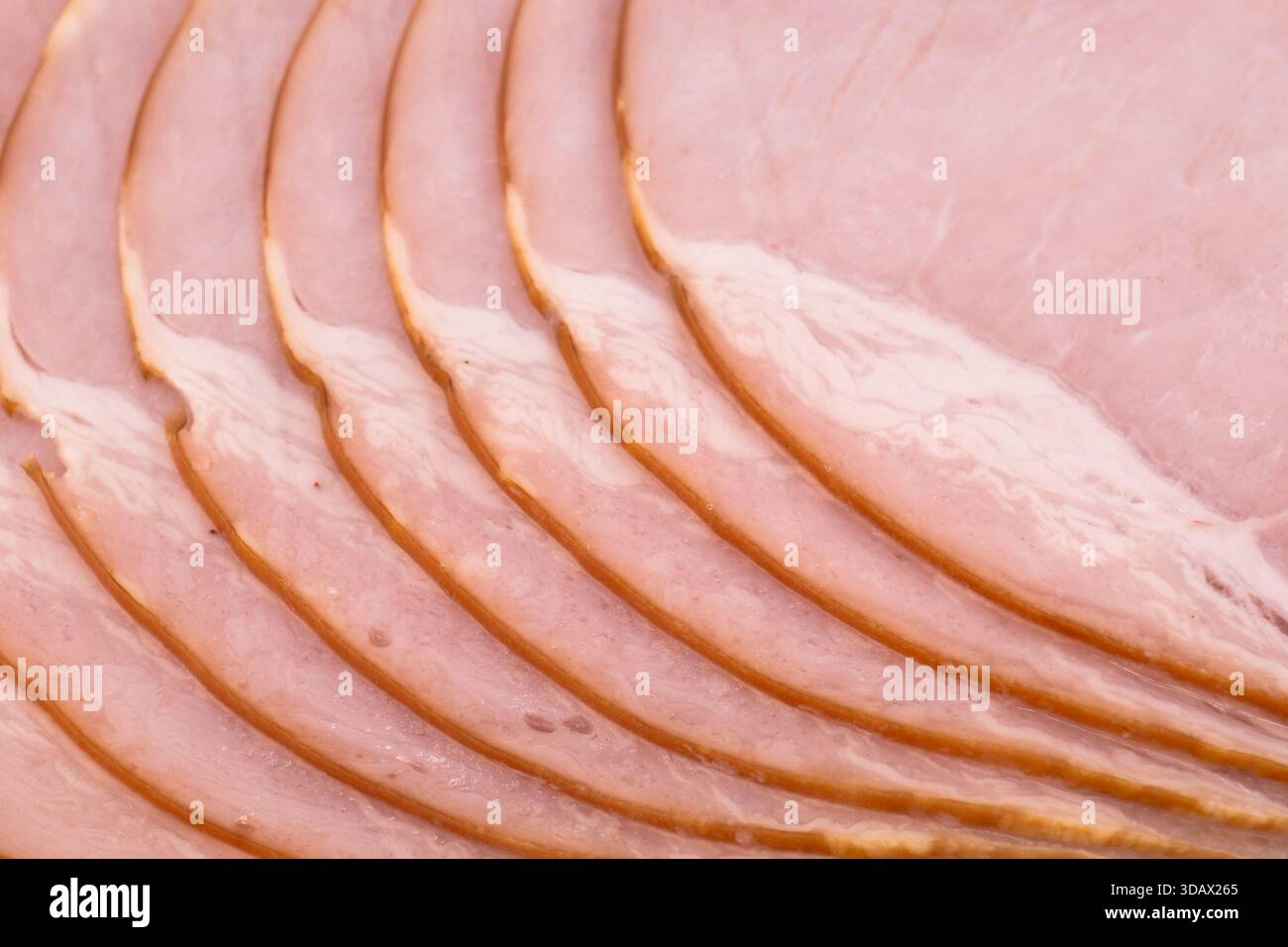 Siced smoked ham meat texture background. Raw ham pattern Stock Photo