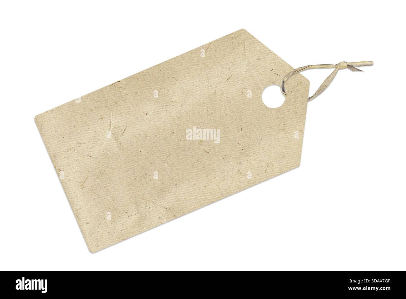 Photo of a beige craft paper tag with twine, blank label isolated on white background, cut out for retail pricing, gift, packaging Stock Photo