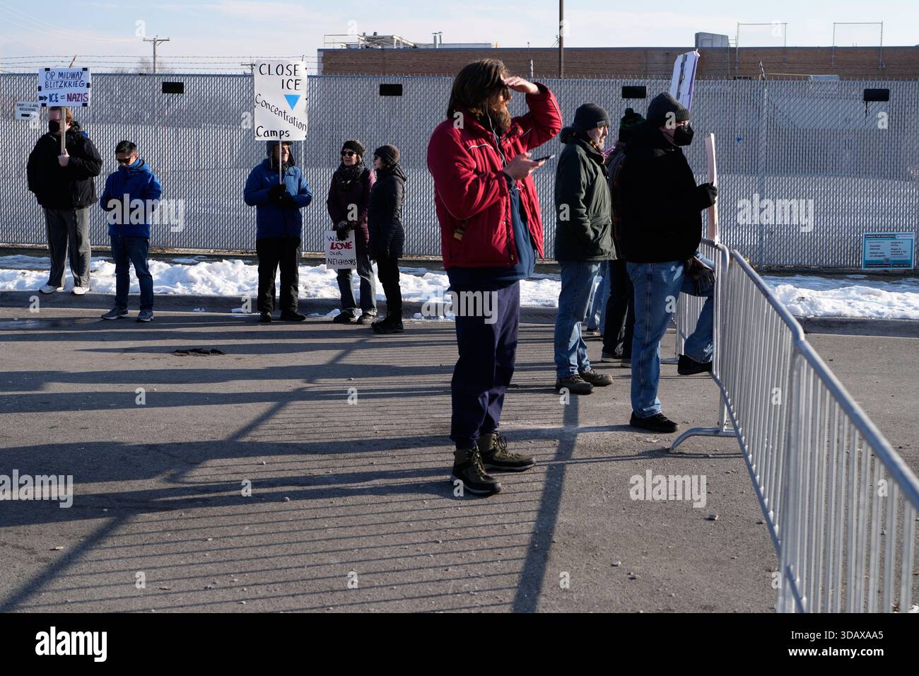 Protesters gather as Law enforcement officers guard outside an ICE ...