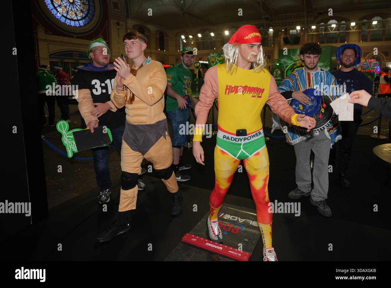 Darts fans in the dress of hotdog arrive to watch the World Darts ...