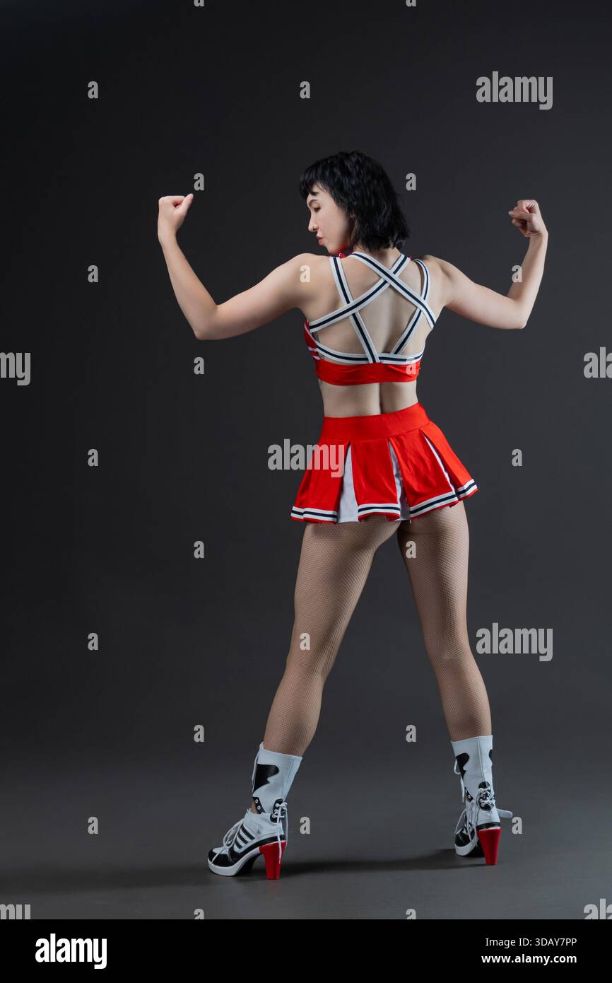 Goth cheerleader, alternative-dressed sports team cheerleader, model in ...
