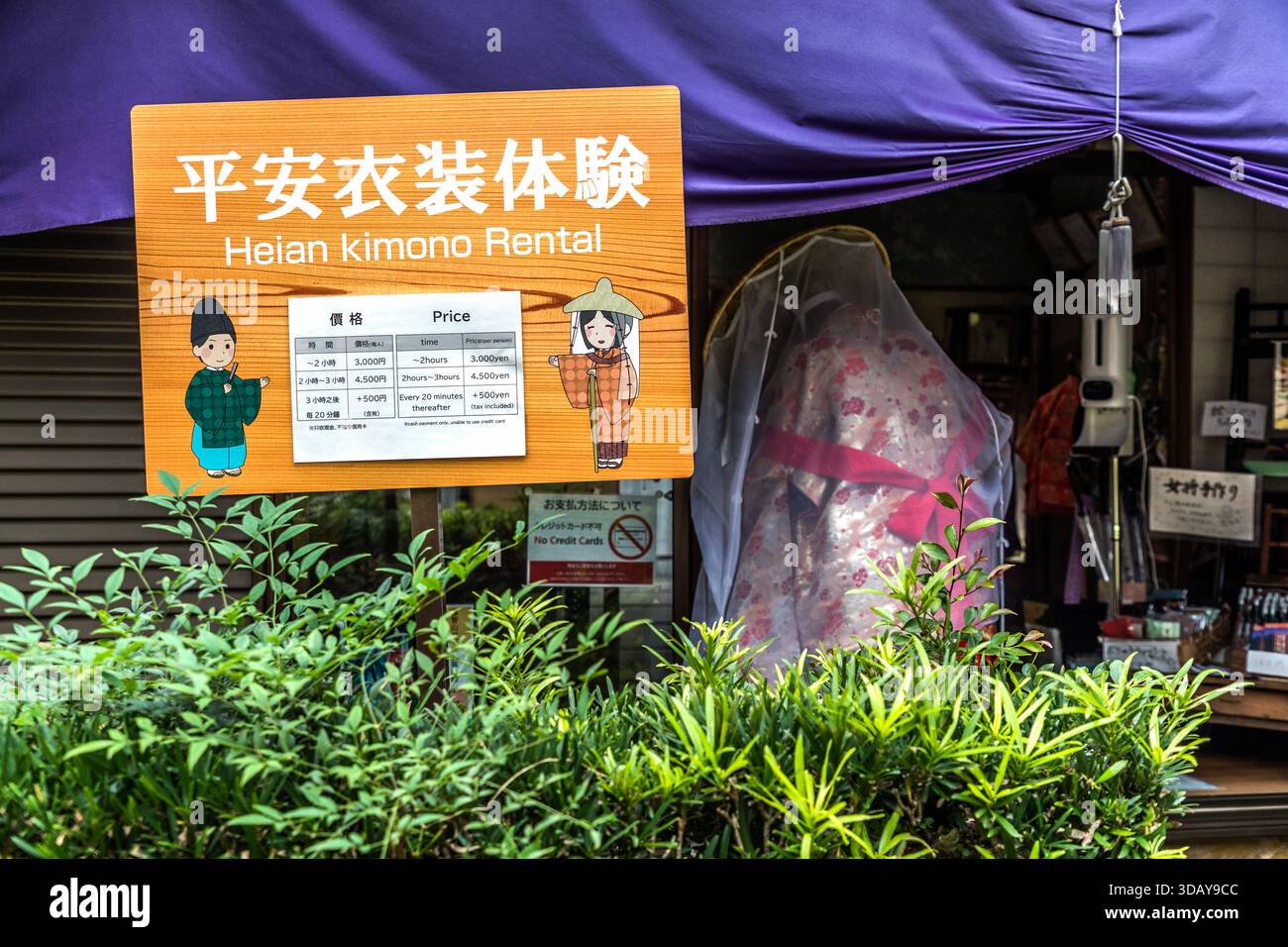 Heian Kimono Rental. Tourists can dress up in kimonos and walk the Kumano Kodo pilgrimage route along the Daimon-zaka section up to Nachi Taisha Shrine. Sign for kimono rental with price list in Nachikatsuura, Wakayama Prefecture, Japan Stock Photo