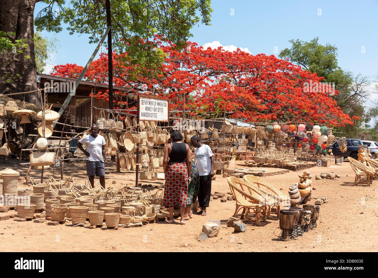 Mangoghi Monkey Island Malawi.16.11.2025.  Female tourists  looking at handmade products for tourists in the Monkey Island region of southern Malawi. - Stock Image