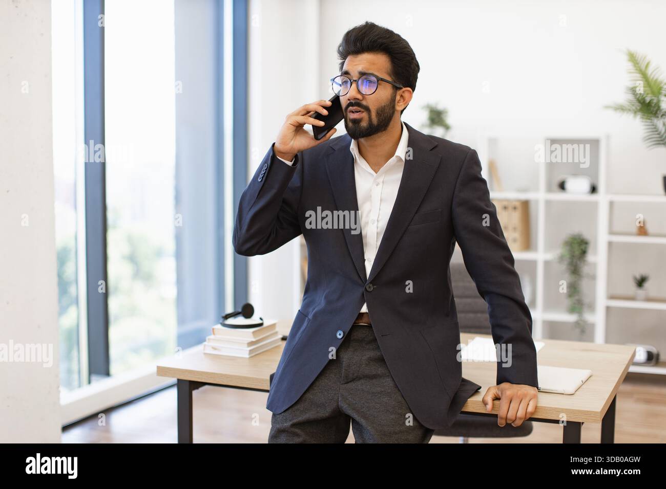 Businessman on Phone in Office Stock Photo