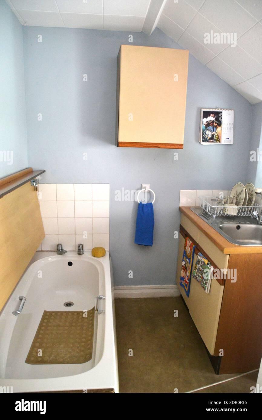 Bath in a 1980s kitchen in a Welsh cottage at St Fagan's National Museum of History, Cardiff, South Wales, UK Stock Photo