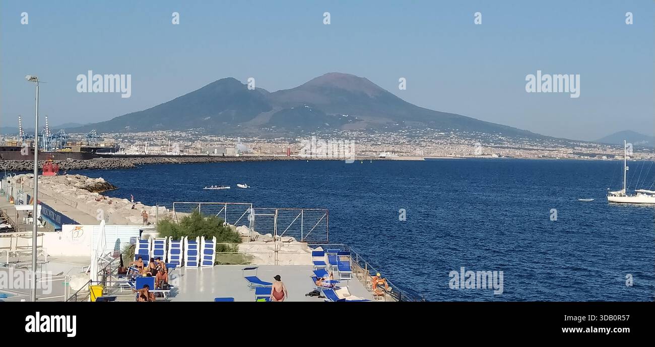 The majestic volcano Vesuvius seen from Piazza del Plebiscito. - Stock Image