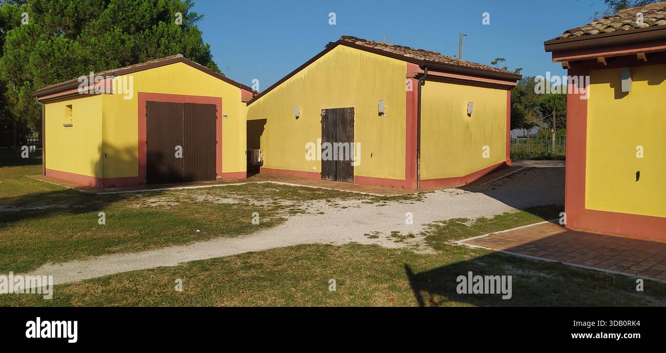 The large tree-lined park and a corner of Finotti near the famous Red House by the writer Alfredo Panzini - Stock Image