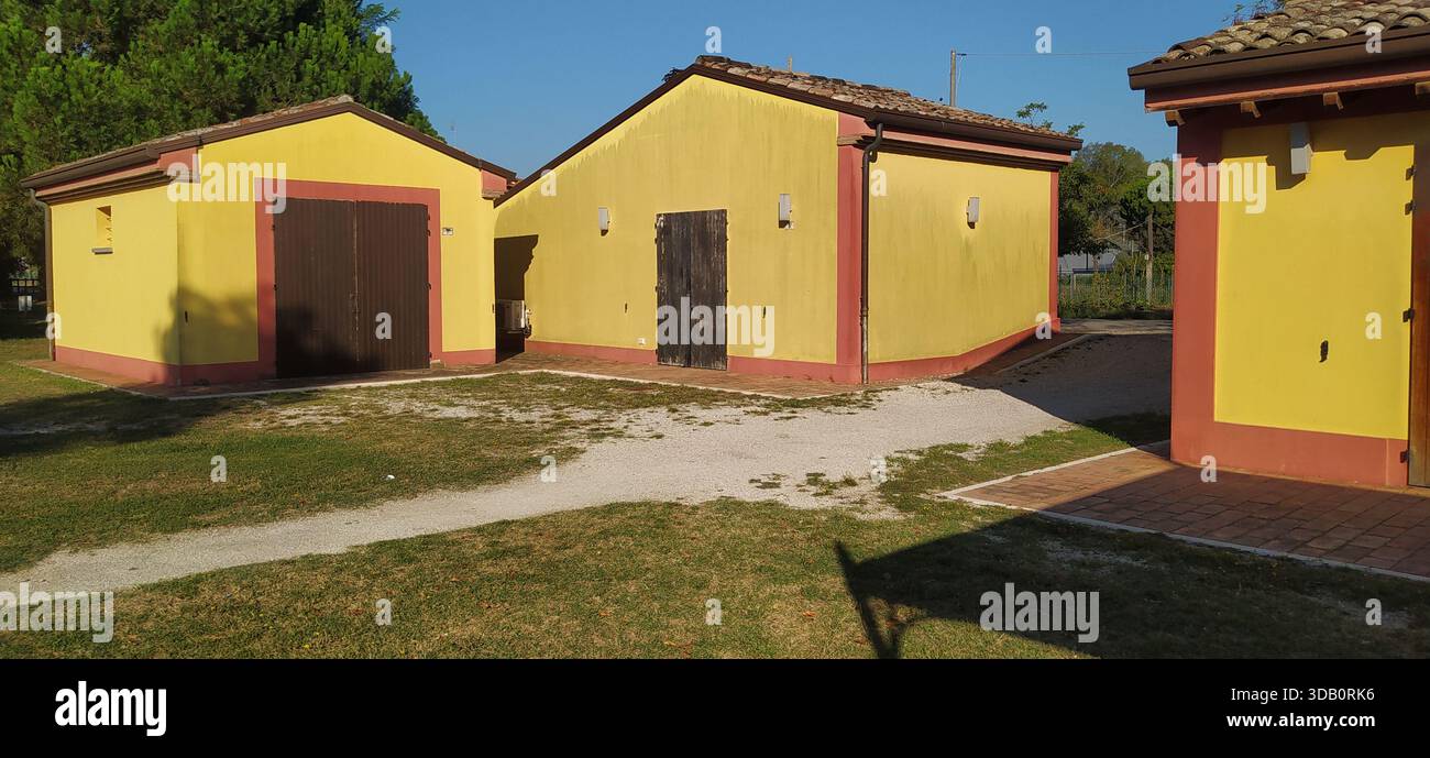 The large tree-lined park and a corner of Finotti near the famous Red House by the writer Alfredo Panzini - Stock Image