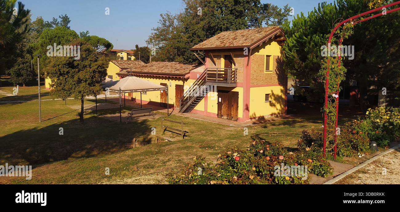 The large tree-lined park and a corner of Finotti near the famous Red House by the writer Alfredo Panzini - Stock Image