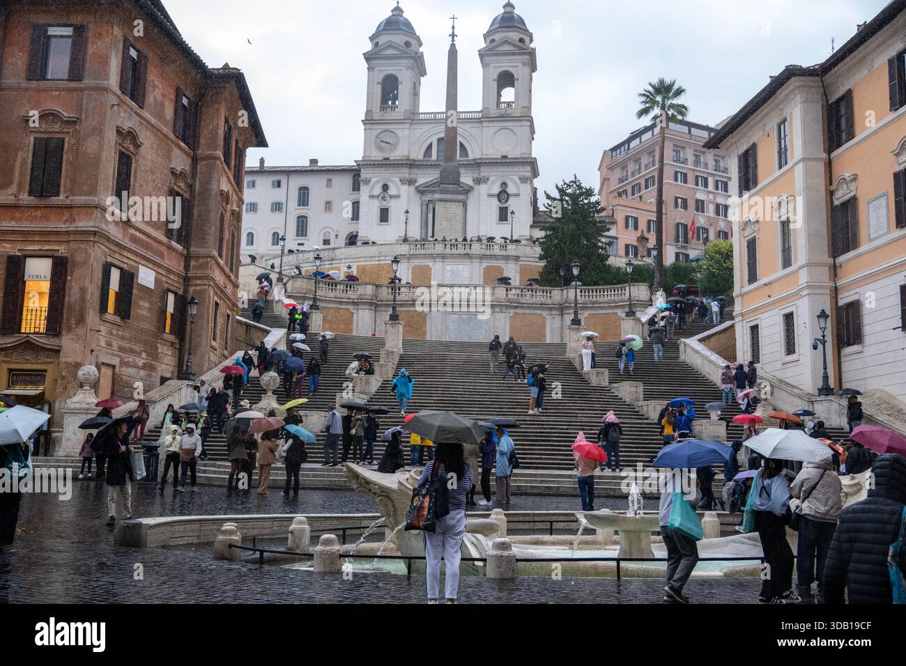 A rainy day at the Spanish Steps, a famous 135-step Baroque staircase ...